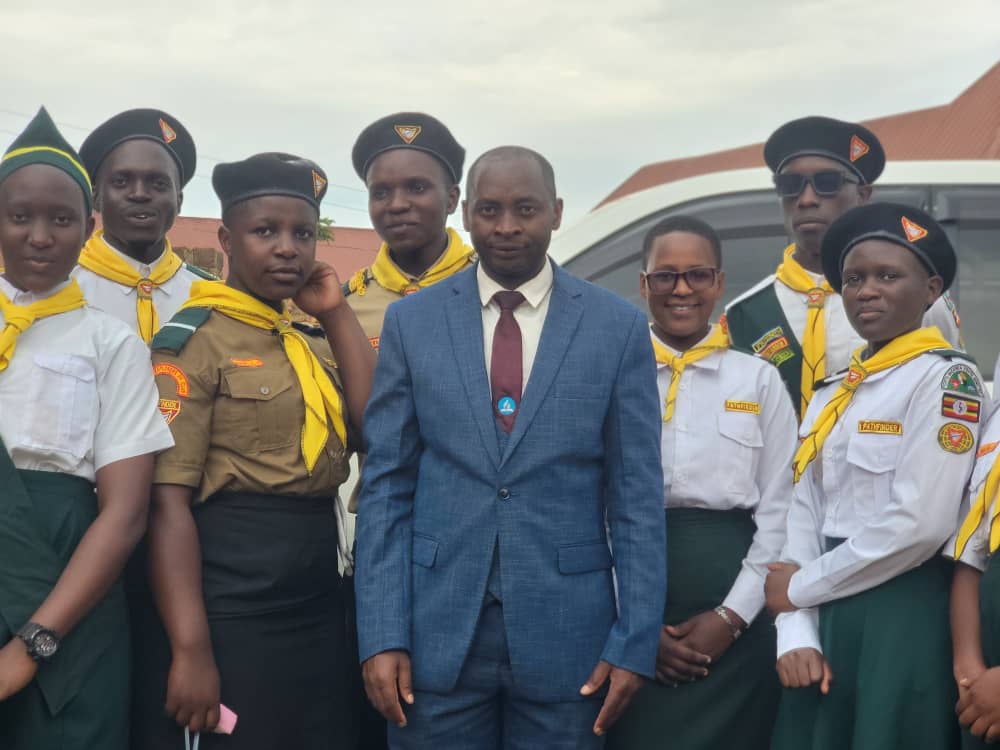 Divine Care Pathfinder Club members in uniform with the head teacher